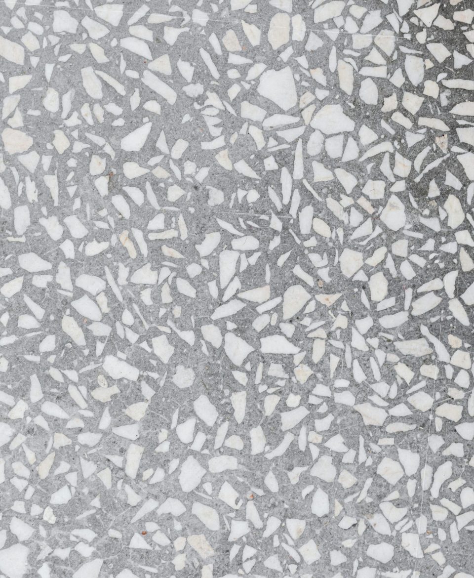 Detailed shot of a terrazzo floor showcasing intricate mosaic patterns.